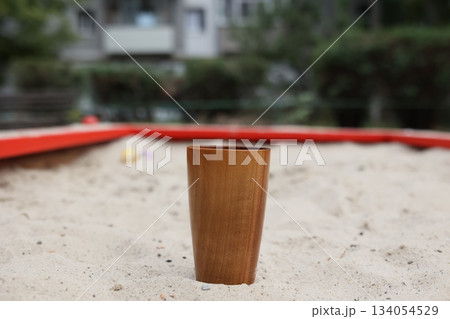 Elegant handmade wood water glass or wooden cup isolated on white background. Elegant handmade wood water glass or wooden cup isolated on white background. 134054529