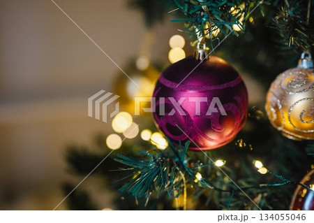 Beautiful Christmas red bauble decoration on Christmas tree, copy space Beautiful Christmas red bauble decoration on Christmas tree, copy space 134055046