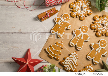 Holiday background. Christmas gingerbread cookies with icing flat lay, festive food, copy space 134055072