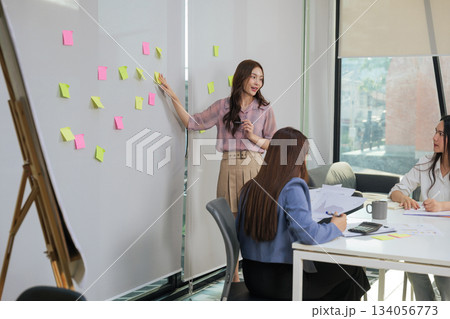 Women meet office work, business people consult hr manager during active collaboration, employees discuss project strategy and corporate planning with colorful sticky notes. 134056773