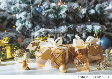 Christmas Gifts in Festive Interior under Sun Light Christmas Gifts in Festive Interior under Sun Light 134058991