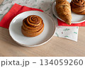 Cinnamon roll and freshly baked pastries on cozy table setting. Christmas mood 134059260