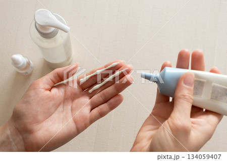 Facial sunscreen moisturizing cream on woman hand. Minimal and clean daily skincare 134059407