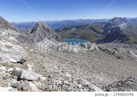 View from Schesaplana mountain showing Lunersee lake and Totalp-Hutte in Ratikon range in Vorarlberg, Austria 134060348