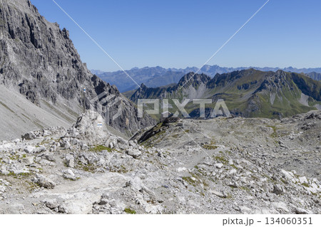 View from Schesaplana overlooking Totalpsee lake and Totalp-Hutte in Ratikon mountain range of Vorarlberg, Austria on a clear day View from Schesaplana overlooking Totalpsee lake and Totalp-Hutte in Ratikon mountain range of Vorarlberg, Austria on a clear day 134060351