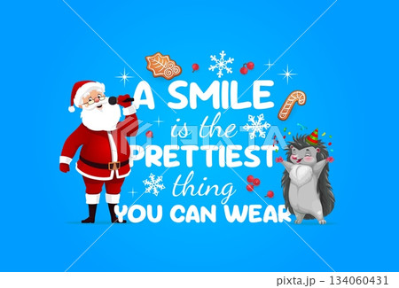 Christmas greeting card with winter holiday quote and Santa, cartoon vector. A smile is the prettiest thing you can wear, Christmas greeting quote with Santa, happy hedgehog and gingerbread cookies 134060431
