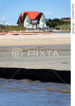 Beautiful seaside beach house on waterfront promenade at the coastal village, West Flanders, sunny summer day, De Haan, Belgium Beautiful seaside beach house on waterfront promenade at the coastal village, West Flanders, sunny summer day, De Haan, Belgium 134061493