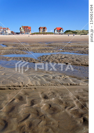 Beautiful seaside beach house on waterfront promenade at the coastal village, West Flanders, sunny summer day, De Haan, Belgium Beautiful seaside beach house on waterfront promenade at the coastal village, West Flanders, sunny summer day, De Haan, Belgium 134061494