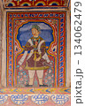 India, mural in a haveli depicting a warrior holding a flower in Mandawa 134062479