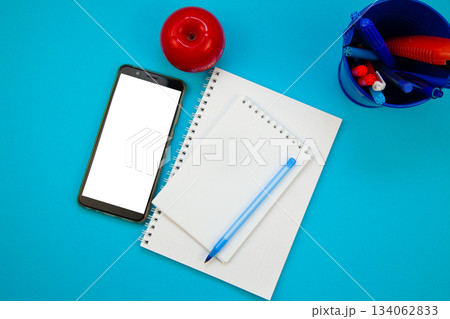 Mobile phone mockup background top view. Workplace copy space. Notepad, notebook and pen. Study and work. Planning. Self-learning. Online course. Education remotely. Cellphone Mobile phone mockup background top view. Workplace copy space. Notepad, notebook and pen. Study and work. Planning. Self-learning. Online course. Education remotely. Cellphone 134062833