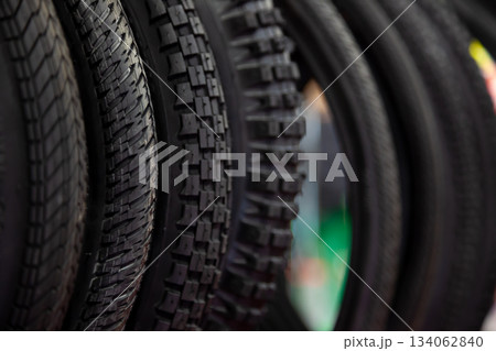 Bicycle tires in close-up. Tire texture. Black background. 134062840