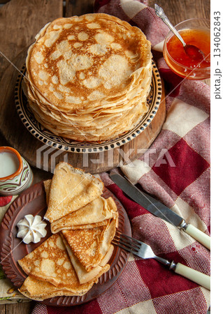 Thin pancakes. Floury food. Breakfast on the table. 134062843