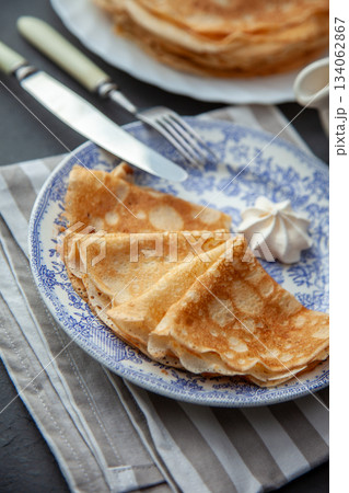 Thin pancakes. Floury food. Breakfast on the table. 134062867