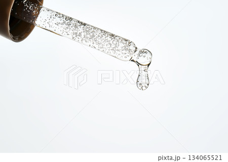 Cosmetic pipette dropping liquid serum with bubbles 134065521