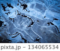 winter background shapes on frozen water surface 134065534