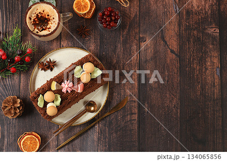 Festive Kitchen Banner.The concept of festive pastries.Homemade winter dessert, stollen, rolls or strudel with sweet cream filling, nuts, cinnamon, cranberries and poppy seeds, and eggnog. Festive Kitchen Banner.The concept of festive pastries.Homemade winter dessert, stollen, rolls or strudel with sweet cream filling, nuts, cinnamon, cranberries and poppy seeds, and eggnog. 134065856