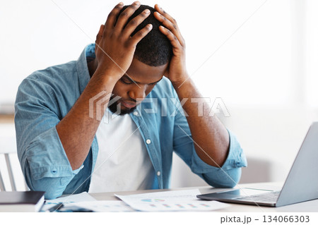Bankruptcy Concept. Depressed Black Businessman Sitting At Desk With Laptop And Financial Papers And Keeping Head In Hands In Despair, Stressed African Entrepreneur Having Problems At Work, Free Space 134066303