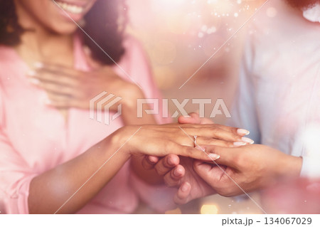 Proposal Concept. Closeup cropped view of unrecognizable young african american man in love putting wedding ring on his woman finger. Wedding, Marriage, Love And Relationship. 134067029