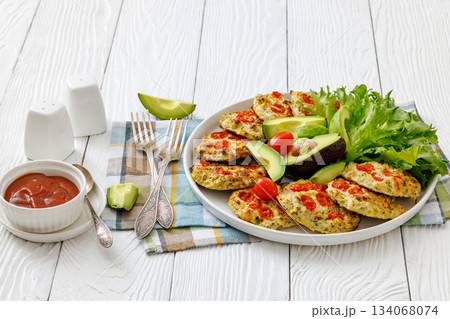 minced chicken cherry tomatoes patties on a plate minced chicken cherry tomatoes patties on a plate 134068074
