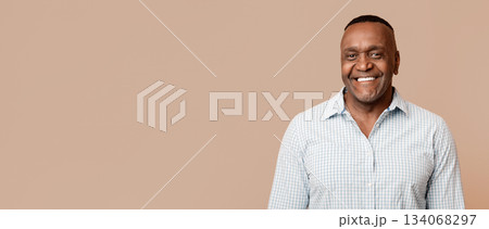 Portrait of middle aged african american man with happy smile, orange background 134068297