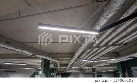 Exposed infrastructure elements create authentic workspace environment 134069102