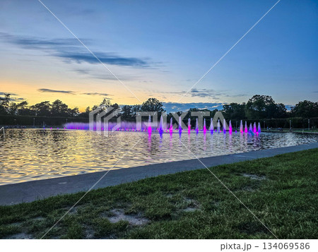 Sunset Serenity Fountain Silhouette Against Golden Sky Sunset Serenity Fountain Silhouette Against Golden Sky 134069586