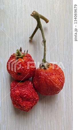 vintage pantry scene with tomatoes, dried cherry tomatoes resting on textured surface evoke memories vintage pantry scene with tomatoes, dried cherry tomatoes resting on textured surface evoke memories 134069679