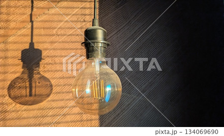warm glow accents textured wall, ambient vintage ambiance with shadow play and warm highlights 134069690