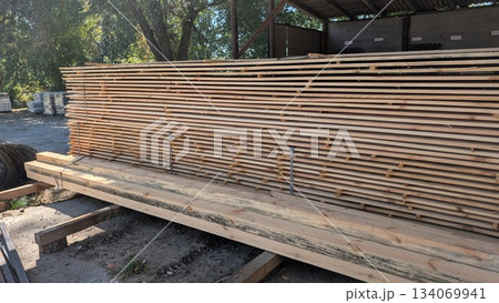 Stacked Lumber in Warehouse for Building Construction and Various Carpentry Projects 134069941
