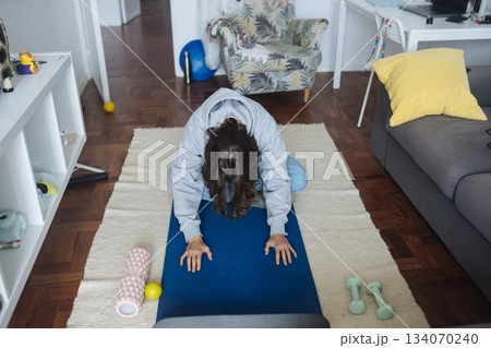 Flexible Fitness Routine In Cozy Space, Morning Exercise Focusing On Flexibility And Balance At Home 134070240