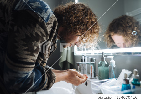 Chef cleans face, Chef rejuvenates appearance following busy service Chef cleans face, Chef rejuvenates appearance following busy service 134070416
