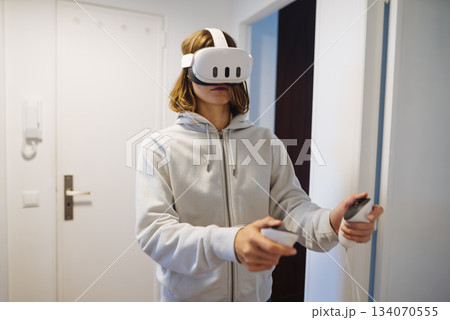 Person demonstrating careful hand control during virtual reality experience Person demonstrating careful hand control during virtual reality experience 134070555