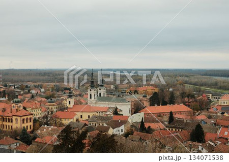 Historic rooftops of Sremski Karlovci with iconic yellow architecture and church towers. The scene conveys heritage, culture, and timeless atmosphere Historic rooftops of Sremski Karlovci with iconic yellow architecture and church towers. The scene conveys heritage, culture, and timeless atmosphere 134071538