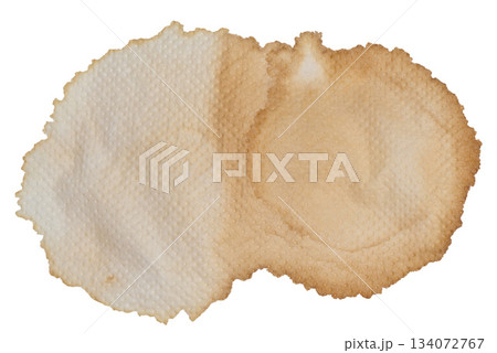 Macro shot of a large, dried coffee stain on a textured white paper napkin Macro shot of a large, dried coffee stain on a textured white paper napkin 134072767