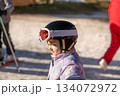 Ski coach giving a lesson to a child 134072972