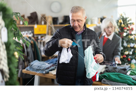 Older man choosing panties in the store 134074855