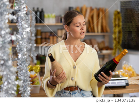 Young woman choosing champagne 134075138