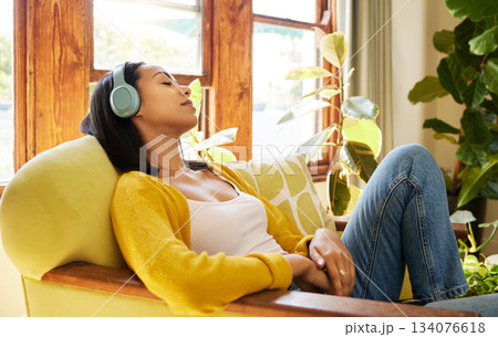 Woman, meditation and headphones, listen to music or podcast for peace and stress relief, sleeping and relax at home. Streaming online, self care and wellness with content female listening to radio Woman, meditation and headphones, listen to music or podcast for peace and stress relief, sleeping and relax at home. Streaming online, self care and wellness with content female listening to radio 134076618