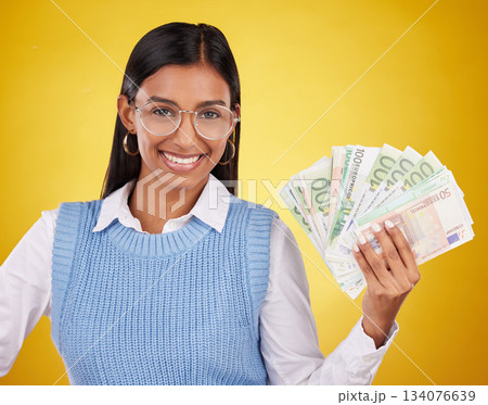 Studio cash money, portrait and woman smile for lottery prize, competition win or dollar bills award. Finance winner, payment or person winning poker, giveaway or casino gambling on yellow background 134076639