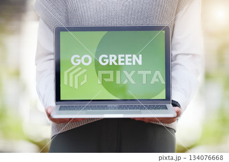 Person, screen or laptop of go green, sustainability or eco friendly conservation website for planet earth. Recycle, technology or global message for carbon footprint, clean energy and climate change Person, screen or laptop of go green, sustainability or eco friendly conservation website for planet earth. Recycle, technology or global message for carbon footprint, clean energy and climate change 134076668