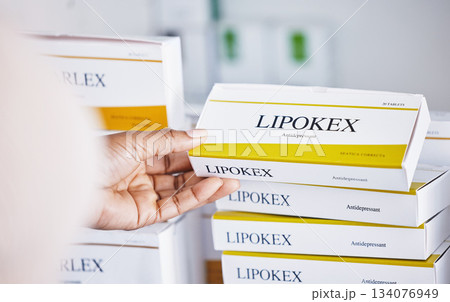 Hands, drugs and shelf for healthcare illness, pain or relief at pharmacy reading pills or medication. Hand of sick customer or patient looking at pharmaceutical products for self diagnosis at clinic 134076949