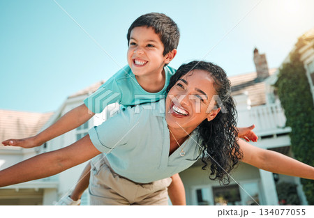 Mother, child or happy family outdoor playing airplane game for fun in backyard. Young woman and boy kid play for happiness, freedom and adventure on a travel holiday with love and a smile outdoor 134077055