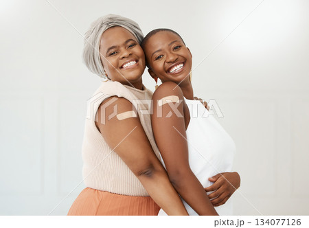 Vaccine, plaster and portrait of black women after an injection as a medical cure isolated in a white background. Healthcare, wellness and happy friends in a hospital or clinic for medicine together Vaccine, plaster and portrait of black women after an injection as a medical cure isolated in a white background. Healthcare, wellness and happy friends in a hospital or clinic for medicine together 134077126