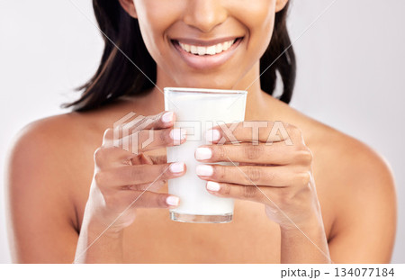 Woman with smile, glass of milk in hands and health with nutrition, vitamins and calcium on studio background. Organic, healthy lifestyle and wellness with happy female, diet and dairy product Woman with smile, glass of milk in hands and health with nutrition, vitamins and calcium on studio background. Organic, healthy lifestyle and wellness with happy female, diet and dairy product 134077184
