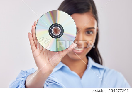 Portrait, happy and woman with cd, excited and technology against a white studio background. Face, female model and person with compact disc, music and sounds with happiness, audio and multimedia Portrait, happy and woman with cd, excited and technology against a white studio background. Face, female model and person with compact disc, music and sounds with happiness, audio and multimedia 134077206
