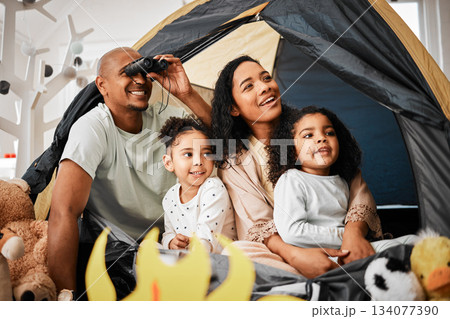 Family, living room and tent with kids, games and toys for bonding, love and playing together. Parents, girl children and looking with mom, dad or camping game in home with happiness on lounge floor Family, living room and tent with kids, games and toys for bonding, love and playing together. Parents, girl children and looking with mom, dad or camping game in home with happiness on lounge floor 134077390