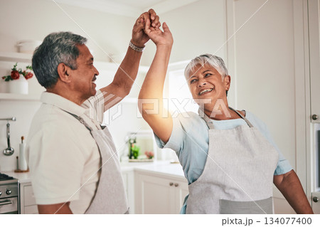Happy, cooking and senior couple dancing in the kitchen together and feeling love, excited and bonding in home. Care, happiness and romantic old people or lovers enjoying dance in a retirement house Happy, cooking and senior couple dancing in the kitchen together and feeling love, excited and bonding in home. Care, happiness and romantic old people or lovers enjoying dance in a retirement house 134077400