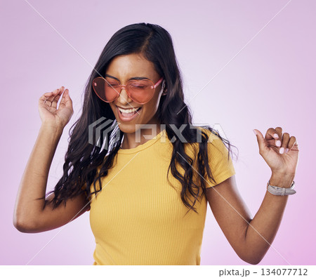 Dancing, sunglasses and cool woman excited, happy and confident isolated in a pink studio background with joy. Singing, music and young genz female dance in celebration of a party energy with glasses Dancing, sunglasses and cool woman excited, happy and confident isolated in a pink studio background with joy. Singing, music and young genz female dance in celebration of a party energy with glasses 134077712
