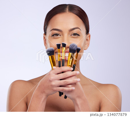 Makeup, smile or portrait of woman with brushes in studio with facial cosmetics or skincare tools. Beauty, face grooming application or happy girl model isolated on white background with mockup Makeup, smile or portrait of woman with brushes in studio with facial cosmetics or skincare tools. Beauty, face grooming application or happy girl model isolated on white background with mockup 134077879