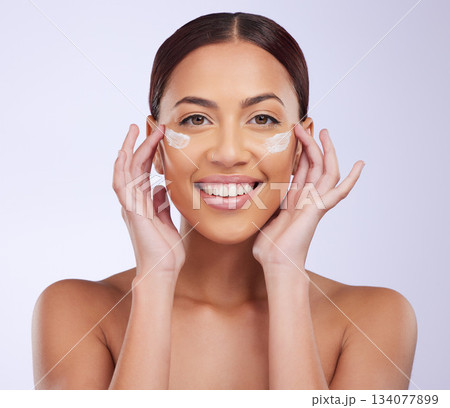 Beauty, skincare or happy woman with sunscreen product in daily grooming treatment with makeup cosmetics. Dermatology, white background or girl model smiling or applying facial cream lotion in studio Beauty, skincare or happy woman with sunscreen product in daily grooming treatment with makeup cosmetics. Dermatology, white background or girl model smiling or applying facial cream lotion in studio 134077899